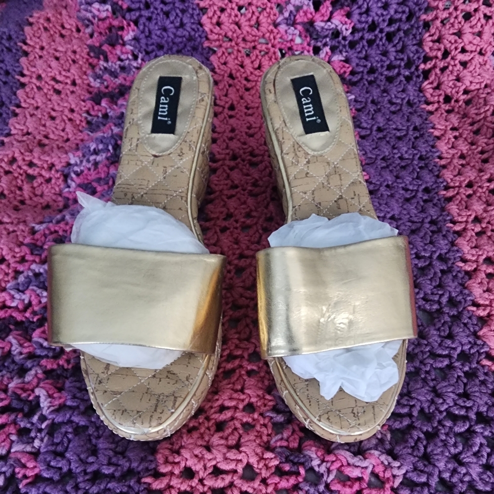Womens wedge heel gold sandal.